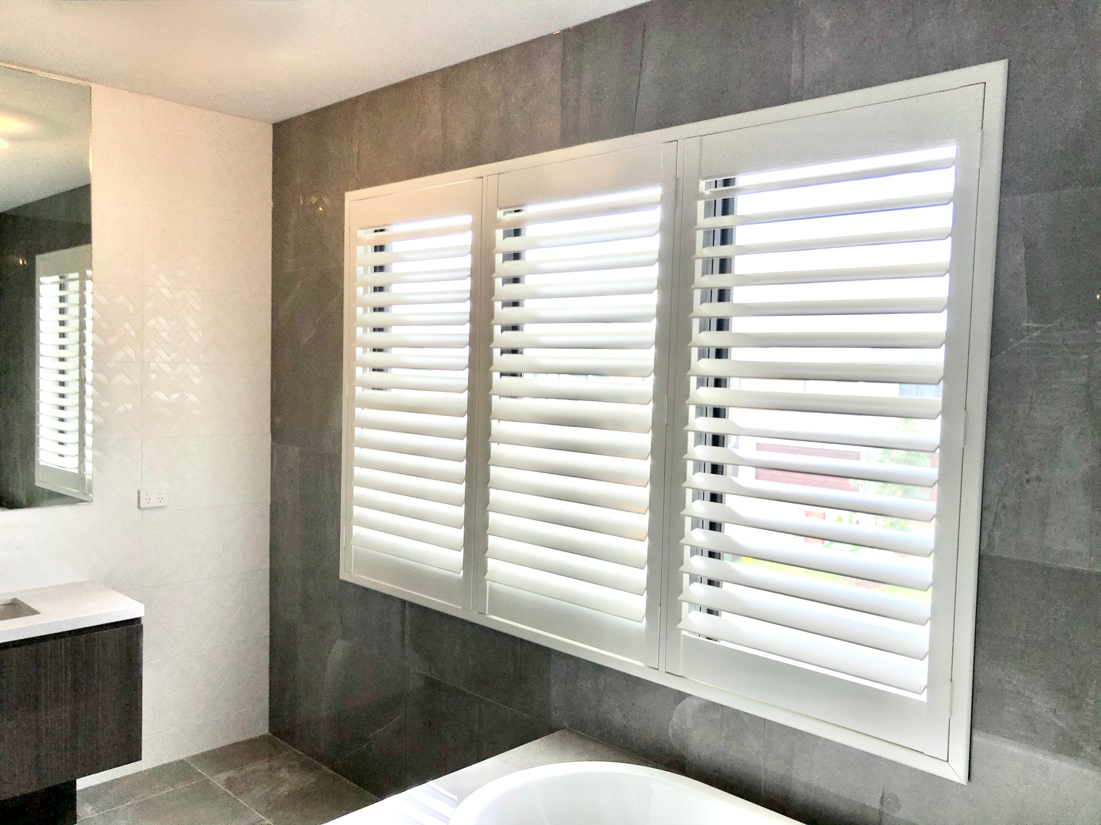 White plantation shutters installed on windows in a Sydney home